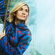 Jodie Whittaker's 13th Doctor looks out as she hangs from a rope dangling from a pirate ship.